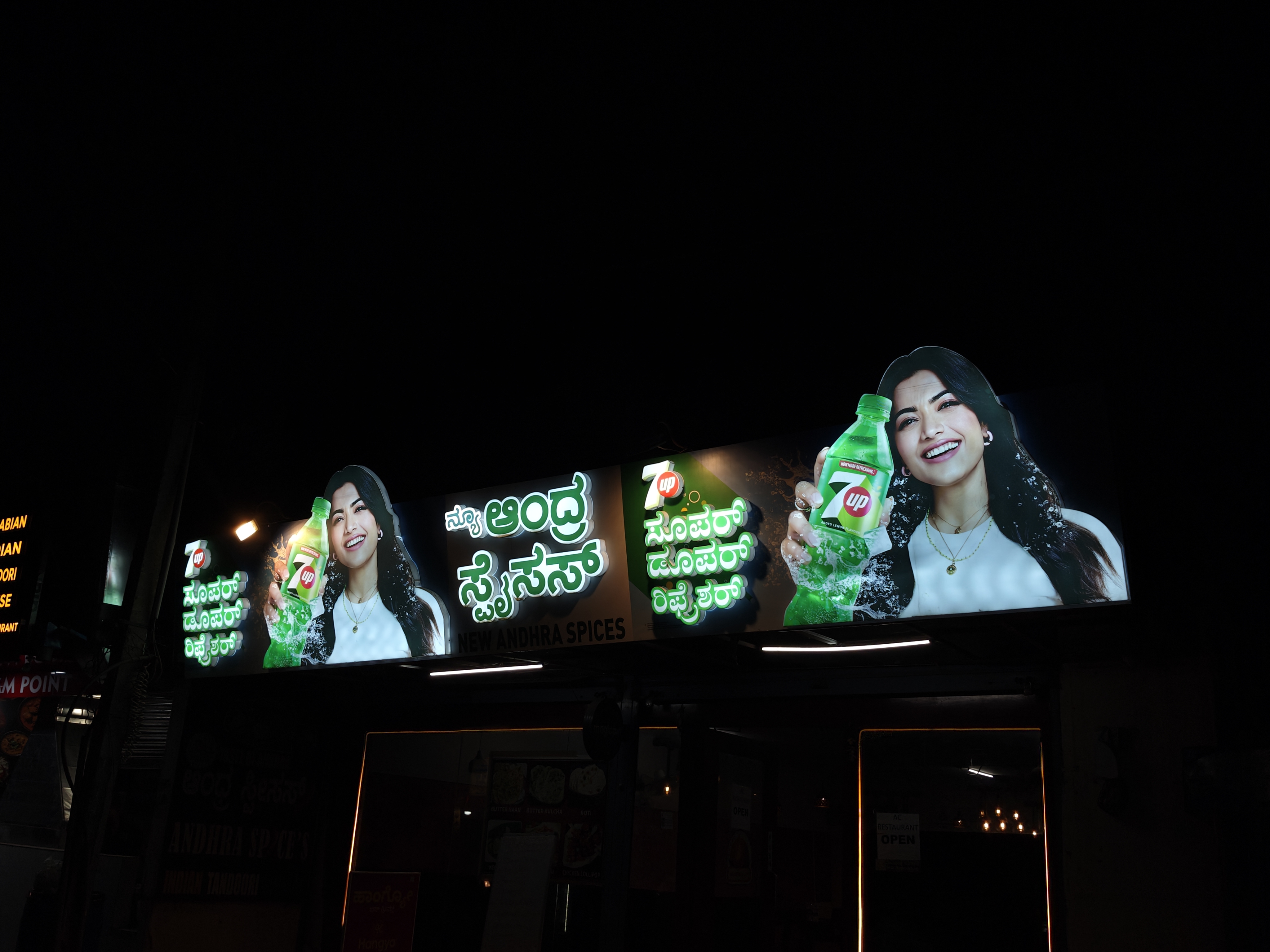 Various types of shop name boards including ACP, glow sign, and non-lit boards displayed outside different Indian stores, showing pricing and installation aspects